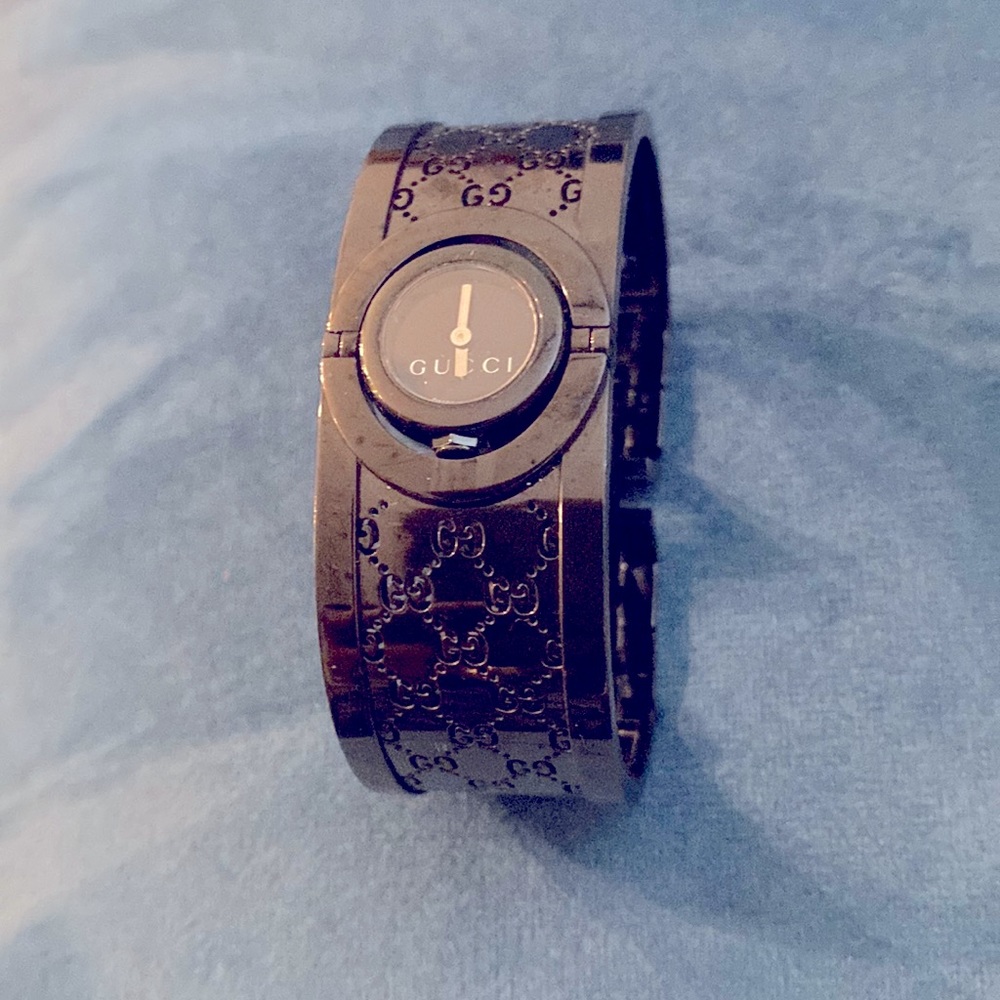 Black color Gucci bangle watch. That watch need battery. Look like new.